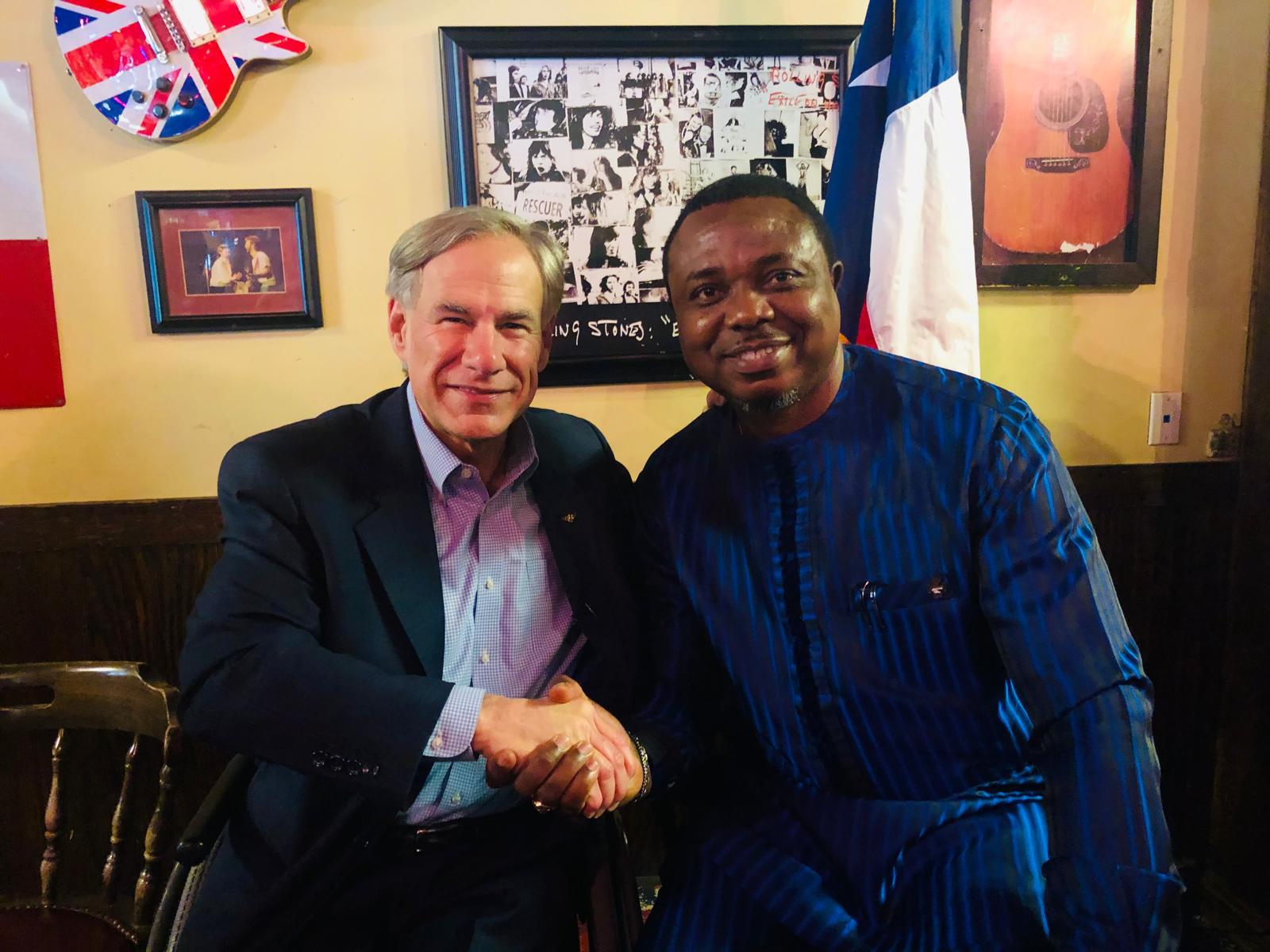 Max Alalibo shaking hands with Texas Governor Greg Abbott